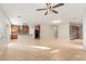 Open concept living room with kitchen, tile flooring, and lots of natural light at 9143 Irish Elk Ave, Las Vegas, NV 89149