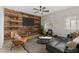 Stylish living room with a wood accent wall, modern furniture, and bright natural light at 9143 Irish Elk Ave, Las Vegas, NV 89149