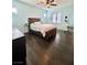 Bedroom with dark wood floors and a large bed at 12113 Rojo Roma Ave, Las Vegas, NV 89138
