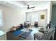 Versatile bonus room with hardwood floors, gym equipment, and seating at 12113 Rojo Roma Ave, Las Vegas, NV 89138