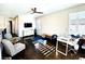 Bonus room with hardwood floors, home office setup, and seating at 12113 Rojo Roma Ave, Las Vegas, NV 89138