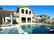 Stunning two-story home with a large pool and pergola at 12113 Rojo Roma Ave, Las Vegas, NV 89138