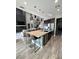 Open concept kitchen boasts an expansive island with seating and high end appliances at 12113 Rojo Roma Ave, Las Vegas, NV 89138