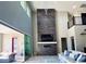 Spacious living room featuring a modern fireplace and access to backyard patio at 12113 Rojo Roma Ave, Las Vegas, NV 89138