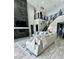Open concept living area with high ceilings, modern fireplace and large windows at 12113 Rojo Roma Ave, Las Vegas, NV 89138