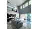 Two story living room with open floor plan, modern kitchen and access to backyard at 12113 Rojo Roma Ave, Las Vegas, NV 89138