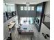 Open concept living area with high ceilings, modern fireplace, and access to backyard at 12113 Rojo Roma Ave, Las Vegas, NV 89138