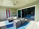 Patio with seating area, and view into the living room at 12113 Rojo Roma Ave, Las Vegas, NV 89138