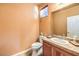 Small bathroom with single sink vanity and wood cabinets at 315 Foster Springs Rd, Las Vegas, NV 89148