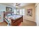 Bright bedroom with wood bed frame, beach themed decor, and window shutters at 315 Foster Springs Rd, Las Vegas, NV 89148