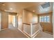 Upstairs hallway with carpet and white railing at 315 Foster Springs Rd, Las Vegas, NV 89148