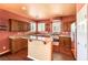 Kitchen features wood cabinets, granite counters, and stainless steel appliances at 315 Foster Springs Rd, Las Vegas, NV 89148
