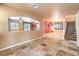 Open living room with tile floors and view of kitchen and dining area at 315 Foster Springs Rd, Las Vegas, NV 89148