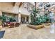 Community clubhouse lobby with comfortable seating and lush tropical plants at 315 Foster Springs Rd, Las Vegas, NV 89148