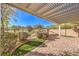 Covered patio with brick pavers and artificial turf at 315 Foster Springs Rd, Las Vegas, NV 89148