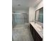 Bathroom showcasing dual sink vanity and glass enclosed shower at 3245 Montage Dr, Henderson, NV 89044