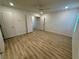 Bedroom with hardwood floors, ceiling fan, and two doors at 3245 Montage Dr, Henderson, NV 89044