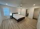 Bedroom with hardwood floors, ceiling fan, and window with blinds at 3245 Montage Dr, Henderson, NV 89044