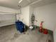 Garage with a water heater and storage and work area at 3245 Montage Dr, Henderson, NV 89044