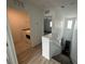 Upstairs hallway with laundry room and bedroom access at 3245 Montage Dr, Henderson, NV 89044