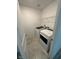 Laundry room featuring tile floors, wire shelving, and front load machines at 3245 Montage Dr, Henderson, NV 89044