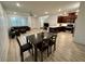 Bright and airy living room with hardwood floors seamlessly connects dining and kitchen areas at 3245 Montage Dr, Henderson, NV 89044