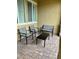 Cozy patio area furnished with outdoor seating and a dark table at 3245 Montage Dr, Henderson, NV 89044
