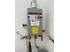 Modern tankless Rheem water heater unit with a digital display at 3245 Montage Dr, Henderson, NV 89044