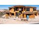 Front view of a new home under construction with framing, roof tile installation, and temporary construction materials onsite at 4 Olympia Summit Dr, Las Vegas, NV 89141