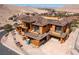 View of a large home under construction featuring expansive windows and a tile roof in progress at 4 Olympia Summit Dr, Las Vegas, NV 89141