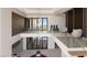 Open-concept home foyer with soaring ceilings, glass railings, and modern decor at 4 Olympia Summit Dr, Las Vegas, NV 89141