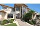 Contemporary home featuring clean lines, a two-story foyer, and desert landscaping at 4 Olympia Summit Dr, Las Vegas, NV 89141