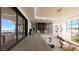 Upstairs hallway with glass railing and modern furnishings leading to an outdoor terrace at 4 Olympia Summit Dr, Las Vegas, NV 89141