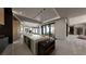 Elegant kitchen featuring a large island, modern appliances, and an open view to the outdoor living space and wine storage at 4 Olympia Summit Dr, Las Vegas, NV 89141