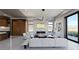 Stylish living room featuring modern furniture, marble fireplace, and an open layout with large windows and access to an outdoor space at 4 Olympia Summit Dr, Las Vegas, NV 89141