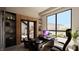 Contemporary office featuring a large window with views, sleek desk, and custom built-in shelving at 4 Olympia Summit Dr, Las Vegas, NV 89141