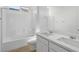 Contemporary bathroom with double sinks, white cabinets, and a shower/tub combo at 651 N Water St, Henderson, NV 89015