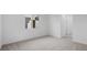 Spacious carpeted bedroom with an adjoining hall and a bright window at 651 N Water St, Henderson, NV 89015