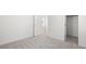 Neutral bedroom features plush carpeting and a view into the closet at 651 N Water St, Henderson, NV 89015