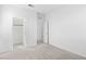 Bedroom featuring neutral walls, plush carpeting, and an entry to a closet at 651 N Water St, Henderson, NV 89015