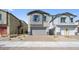 Charming two-story home with a brick driveway and attached two-car garage at 651 N Water St, Henderson, NV 89015