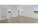 Bright loft area boasts wood-look tile flooring and multiple windows providing ample natural light at 651 N Water St, Henderson, NV 89015