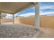 Outdoor covered patio with brick flooring and a view of the backyard wall at 853 Bittern Lake St, Henderson, NV 89011