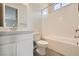 Clean bathroom with tile floors, a tub, and vanity with a solid-surface countertop at 853 Bittern Lake St, Henderson, NV 89011