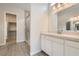 Bathroom features a walk-in shower, dual sinks, and a walk-in closet at 853 Bittern Lake St, Henderson, NV 89011