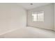 Neutral bedroom with carpeted floors and a window view of the exterior at 853 Bittern Lake St, Henderson, NV 89011