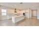 Open kitchen with white cabinets, stainless steel appliances, and a large island at 853 Bittern Lake St, Henderson, NV 89011