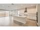 Modern kitchen with white cabinets, stainless steel appliances, and a spacious center island at 853 Bittern Lake St, Henderson, NV 89011
