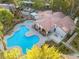 Community pool and clubhouse with surrounding landscaping at 2130 Sealion Dr # 207, Las Vegas, NV 89128