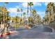 Gated community entrance with palm trees at 2130 Sealion Dr # 207, Las Vegas, NV 89128